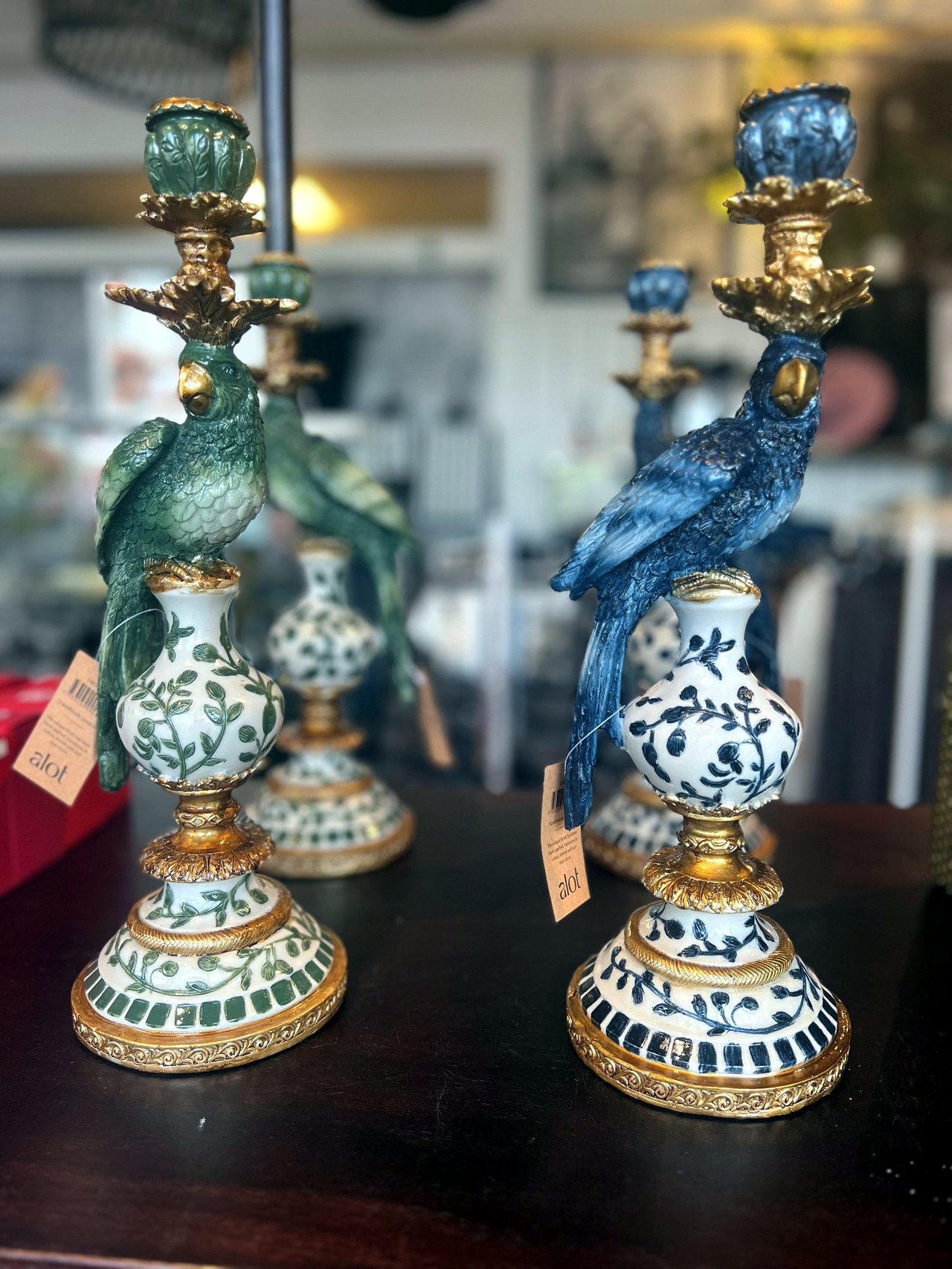 Decorative candlesticks with blue and green parrots on porcelain bases